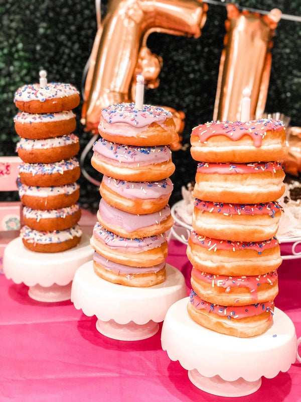 Stacks of donuts on a cake stand for a donut theme party
